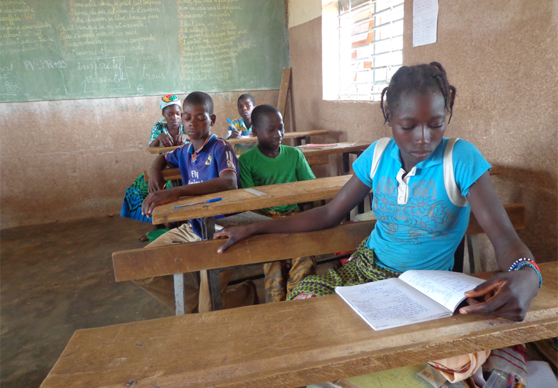Burkina_Faso-girl_reading_in_classroom-Counterpart