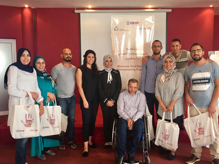 CSOs and coalition participants at a CSSP workshop on Communication for Development display project bags communicating the message to “Stop Violence” (September 27-29, 2017, Tangier)