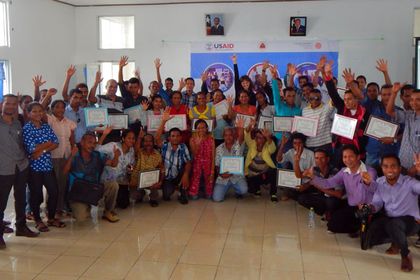 Timorese Villagers pose for a photo after completing a training on leadership provided by USAID and Counterpart International